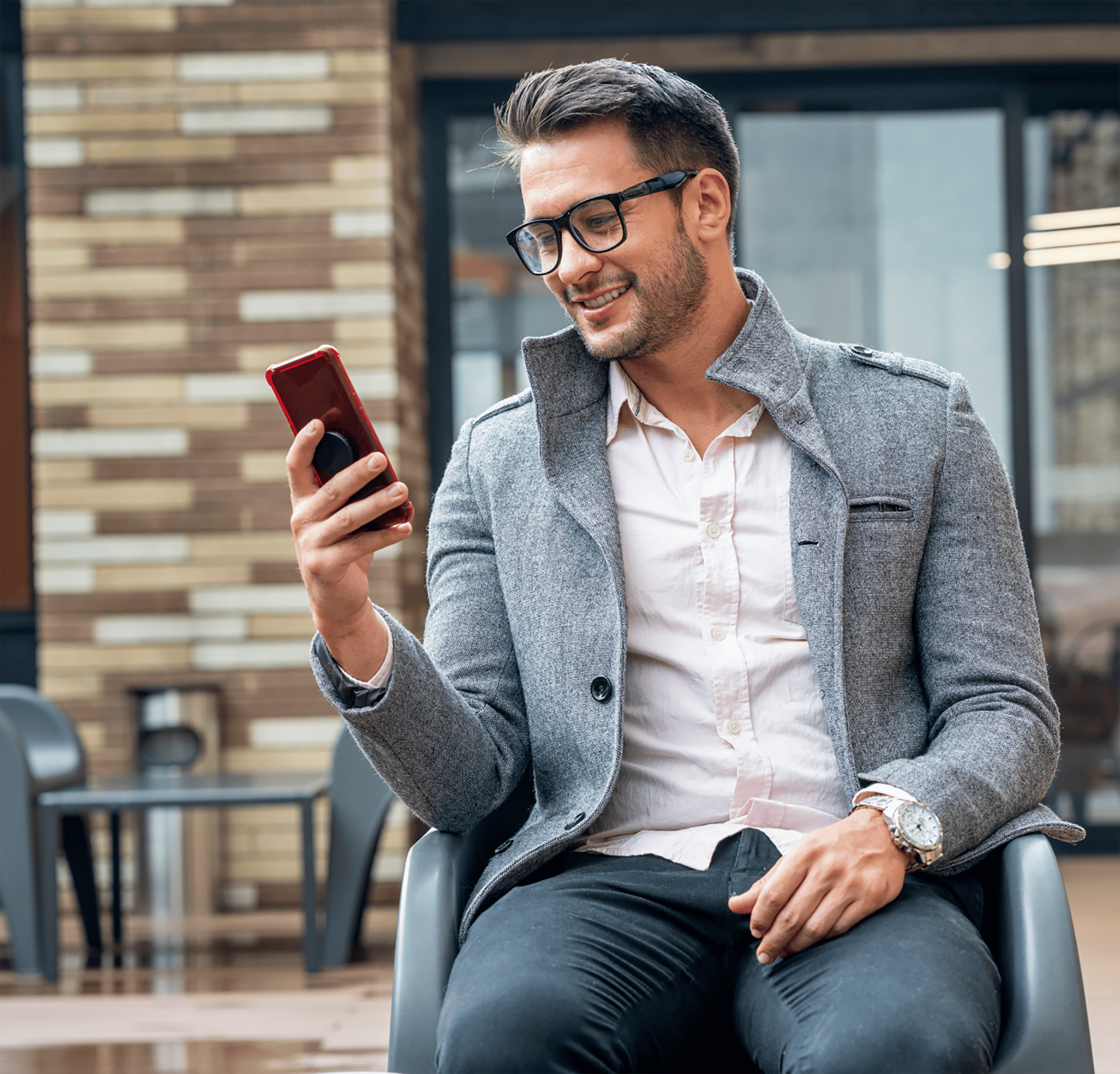 Man using phone outside sitting